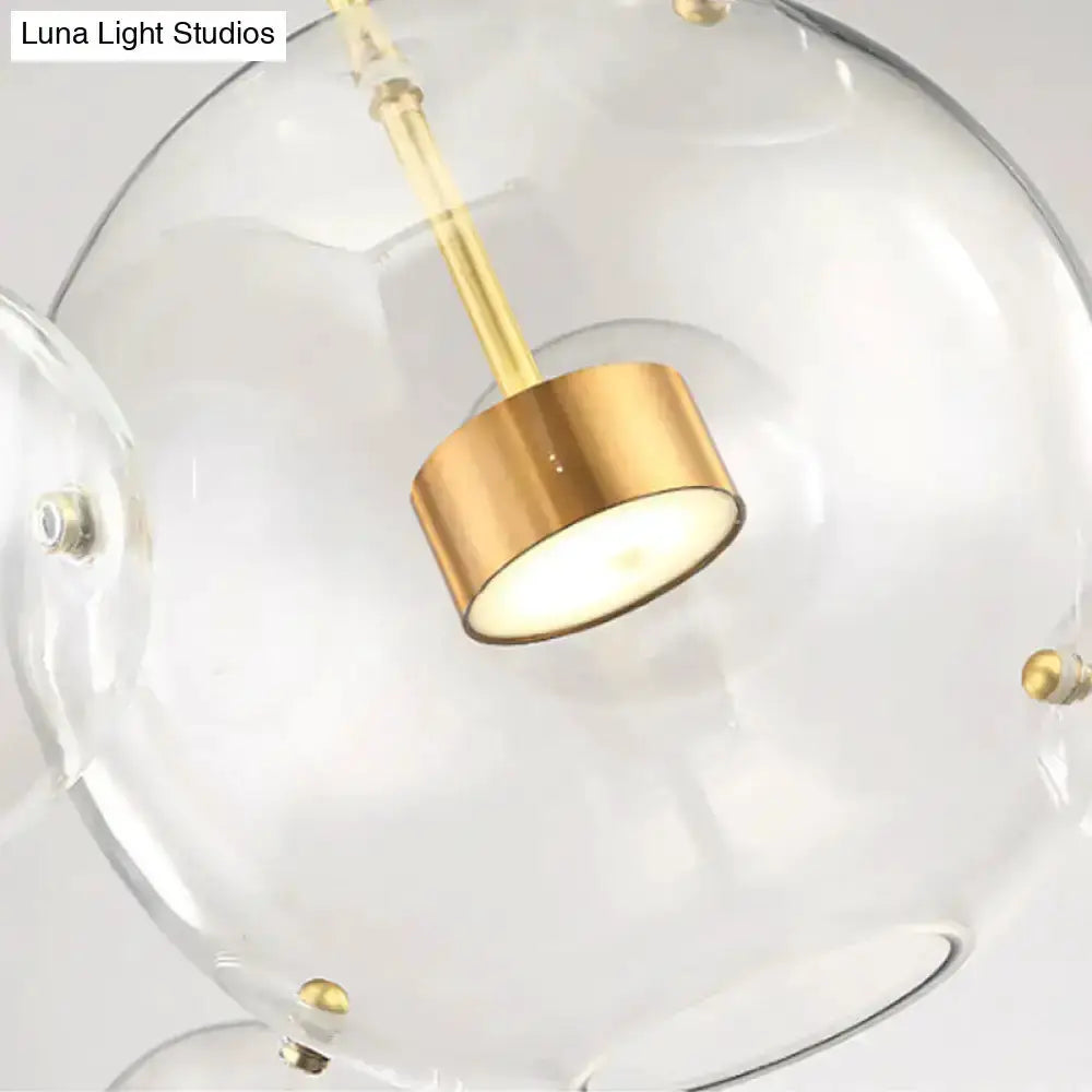Modern brass bubble cluster pendant light by Decorbites with clear glass globes on Tampa Home & Garden Store