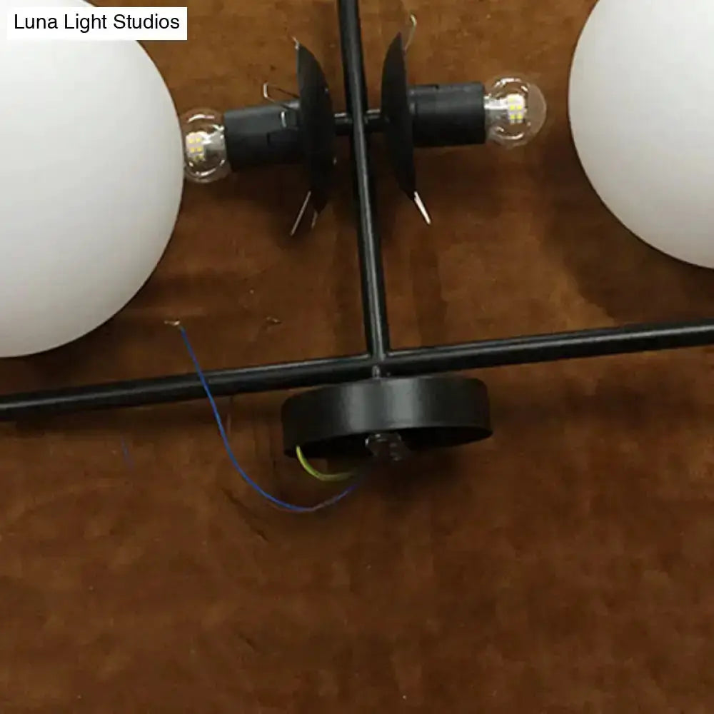 Modern black and white spherical wall light by Decorbites with two white globes on Tampa Home & Garden Store