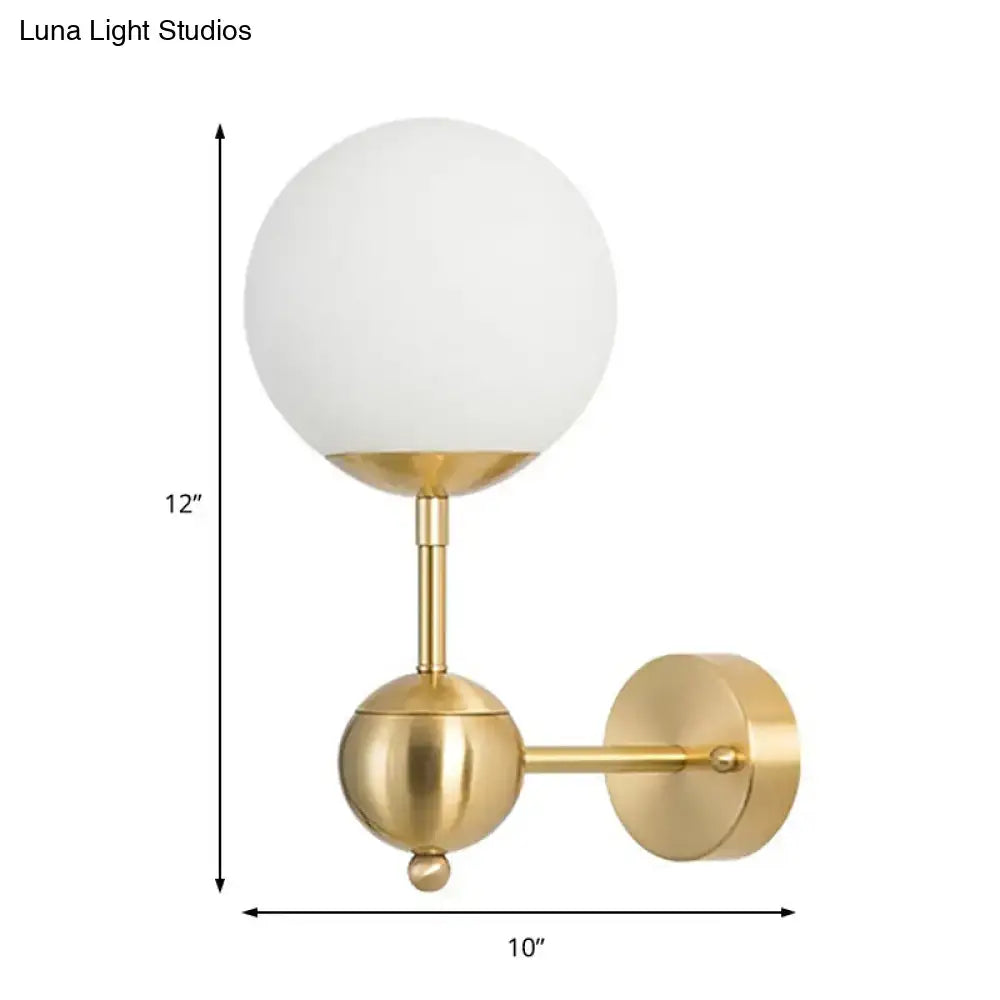 Decorbites brass globe bathroom sconce with frosted glass shade and wall-mount backplate on Tampa Home & Garden Store
