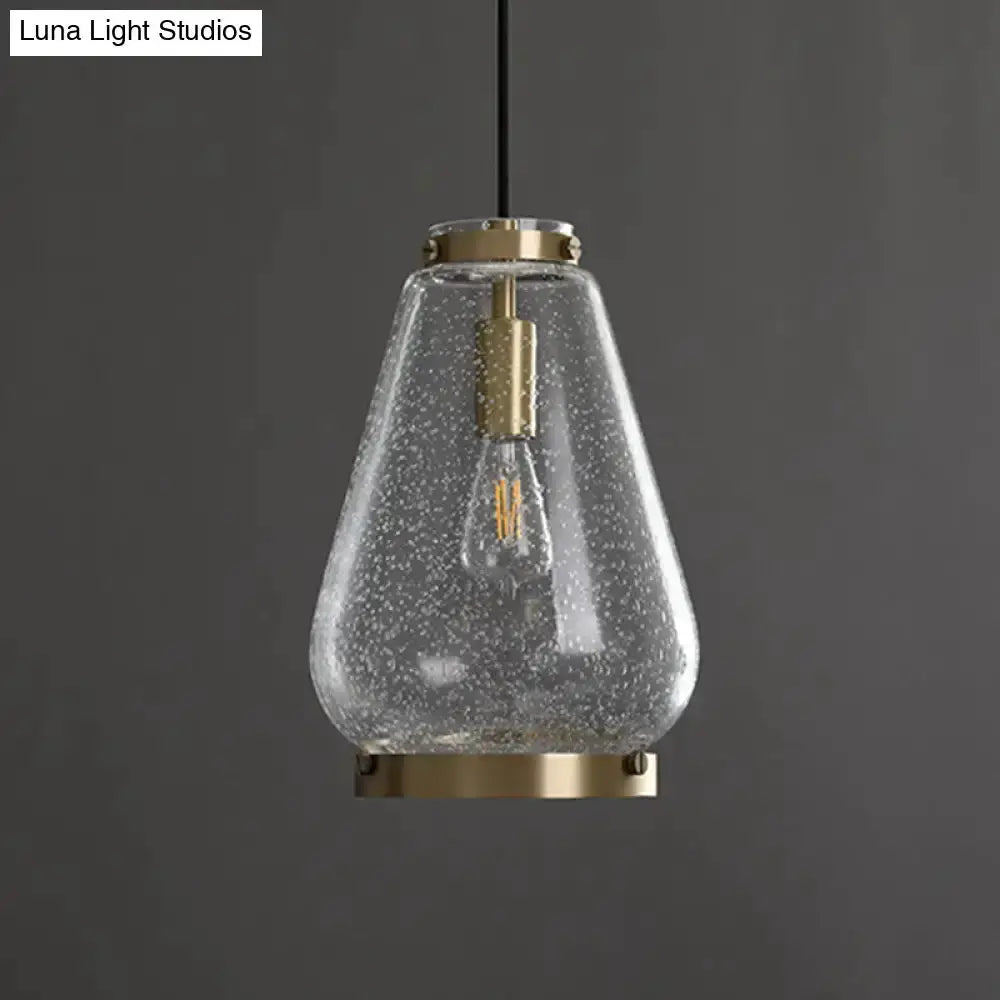 Modern seeded glass pendant light with brass rim for bedroom on Tampa Home & Garden Store