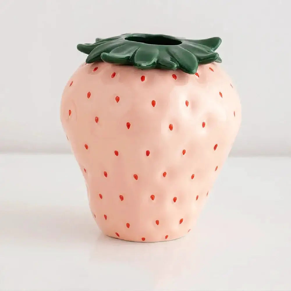 Strawberry-shaped ceramic planter pot in pink with a green leafy rim, Decorbites small pot on Tampa Home & Garden Store