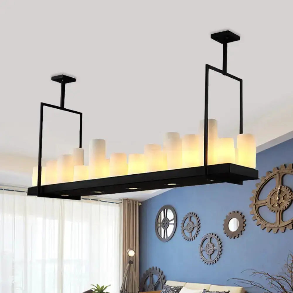 Black barrel island pendant light with frosted glass cylinders on a linear metal frame on Tampa Home & Garden Store