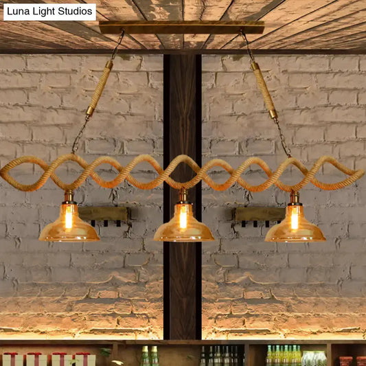 Vintage amber glass pendant lights, 3-light with rope-wrapped cords and beige barn style bulbs on Tampa Home & Garden Store