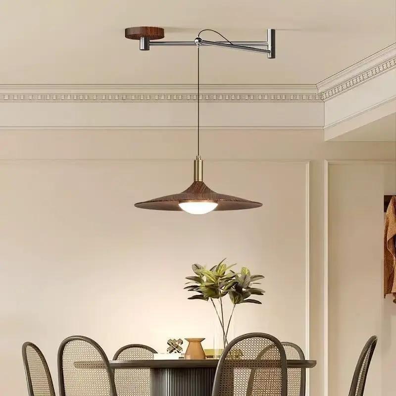 Walnut wood dining room chandelier with iron frame by Decorbites over a dining table on Tampa Home & Garden Store