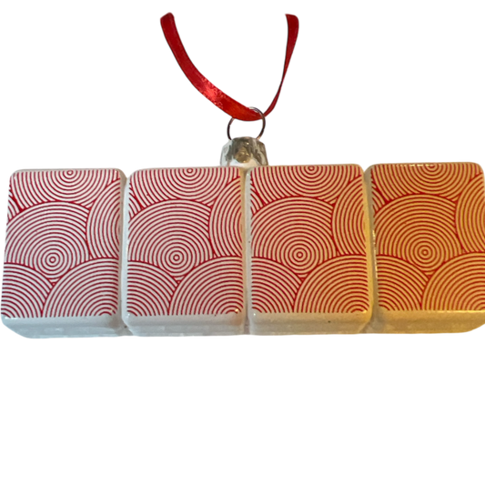 Glass Mahjong Ornament with four white tiles in red spiral patterns, red ribbon hanger on Tampa Home & Garden Store
