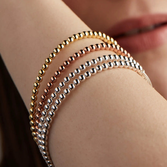 Dot Beaded Bracelet set in gold-tone, rose-gold, and silver-tone beads worn on wrist on Tampa Home & Garden Store