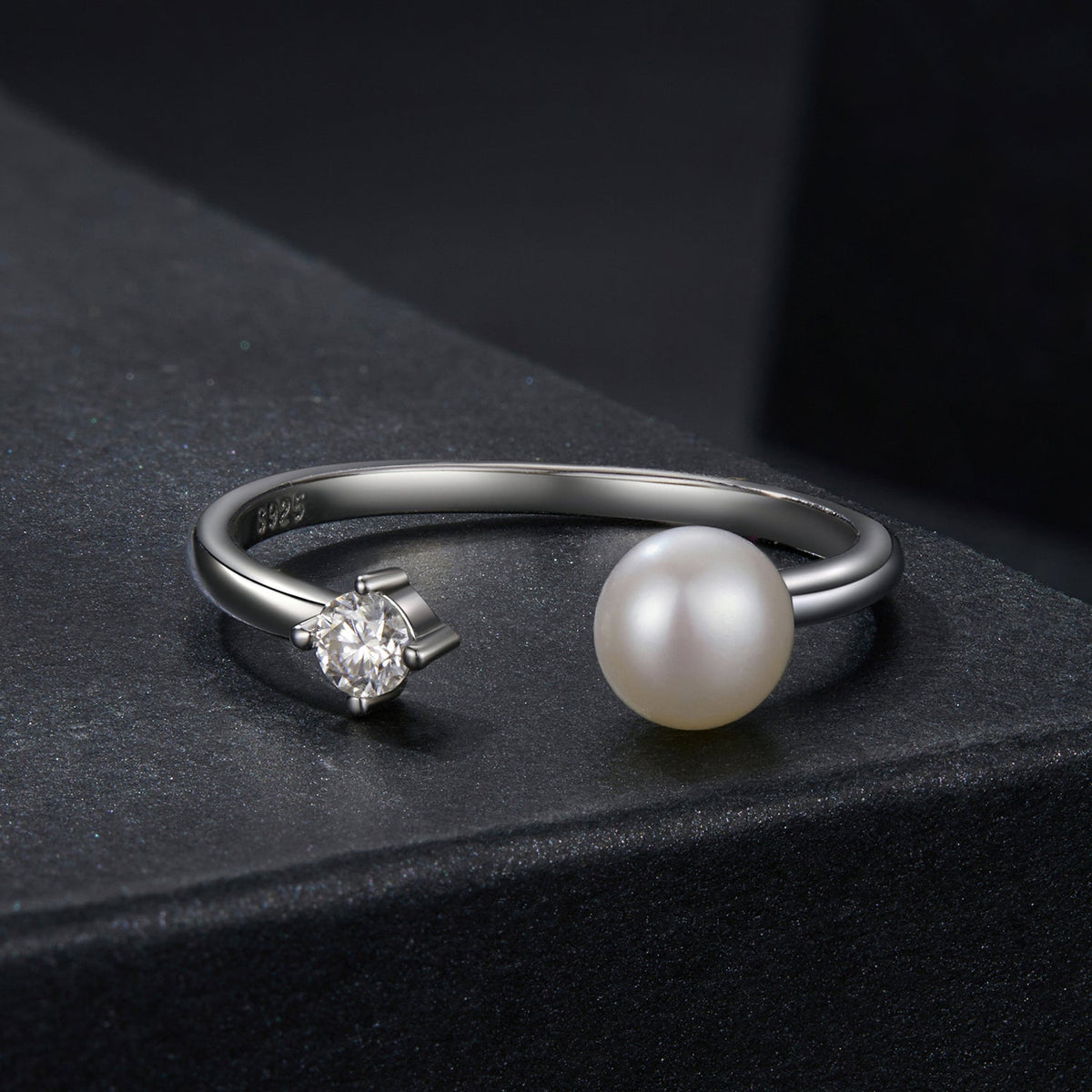 Sterling silver ring with moissanite gemstone and large shell pearl end, two-end design on Tampa Home & Garden Store