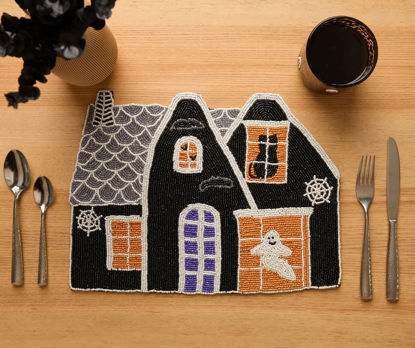 Haunted House Beaded Placemat with black house and orange window panels on Tampa Home & Garden Store