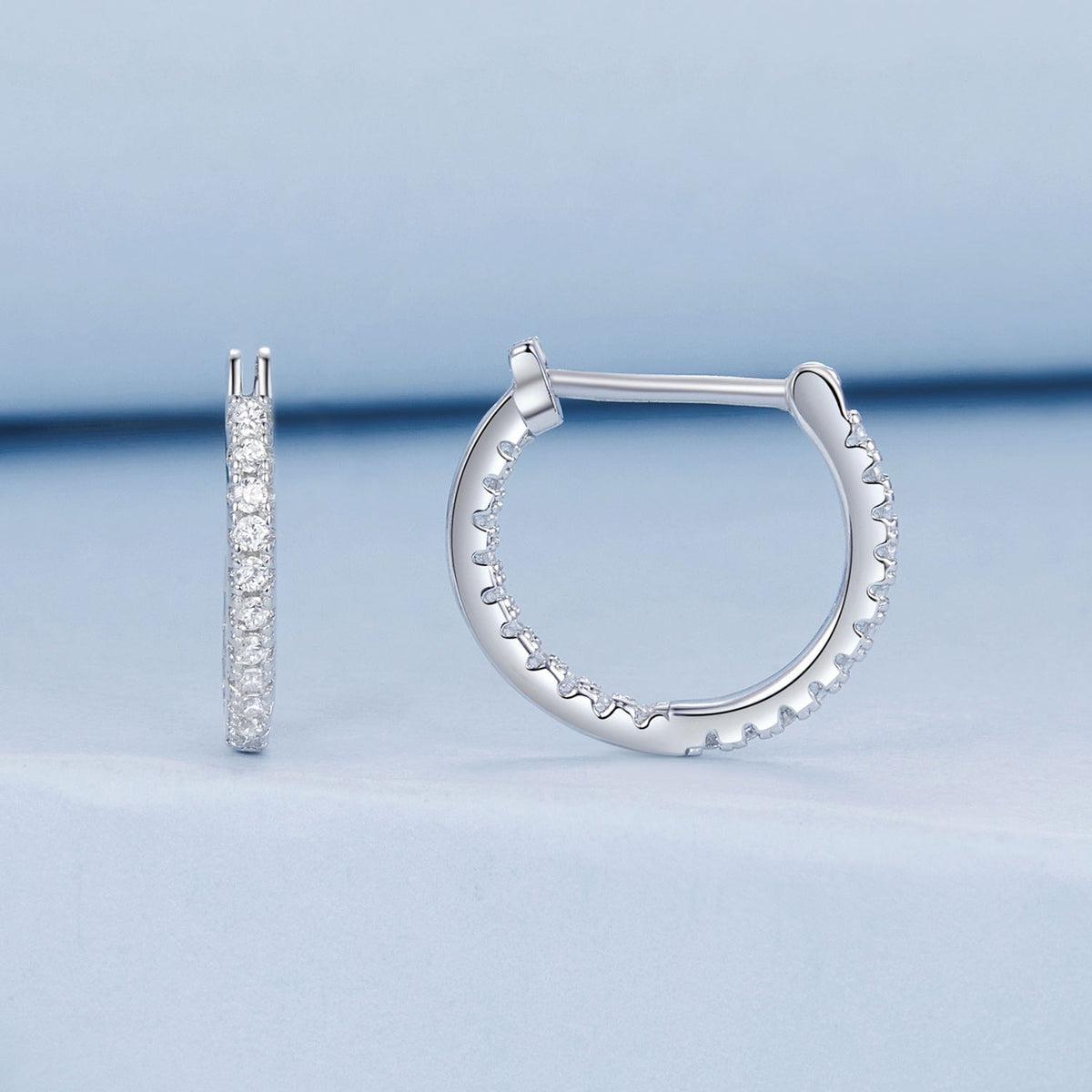 Pair of sterling silver hoop earrings with pave CZ, white gold finish on Tampa Home & Garden Store