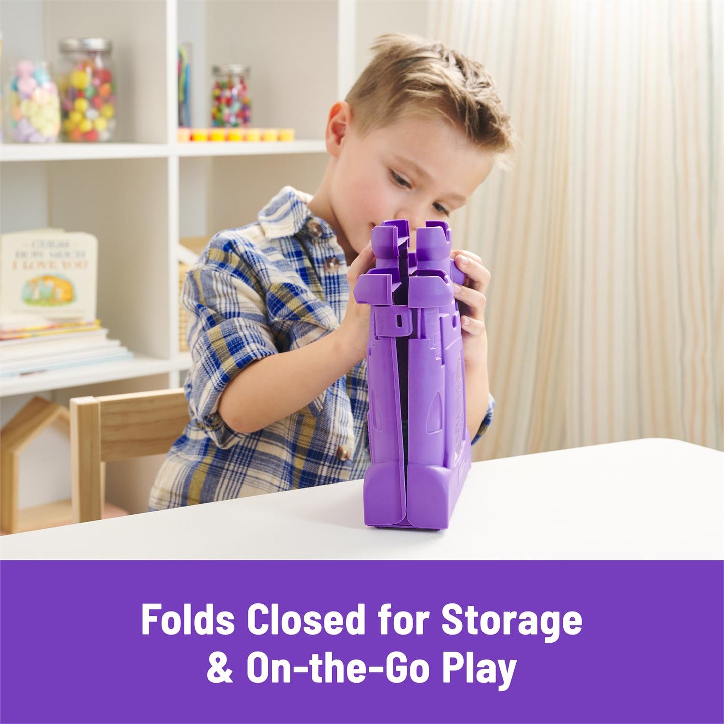 Kinetic Sand Castle Case with Sand Kit, purple plastic castle storage being assembled by a child on Tampa Home & Garden Store