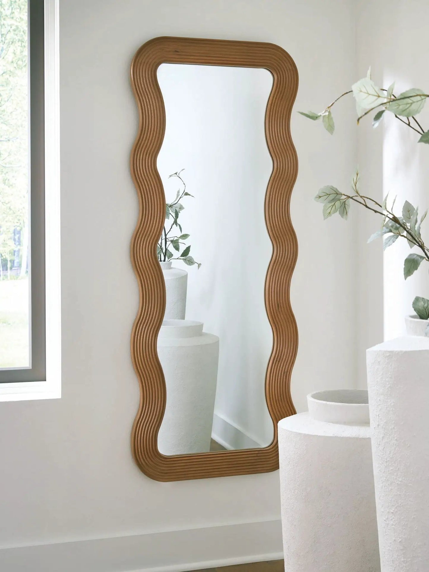 Ellisonville brown floor mirrors by Unique Piece Furniture pair with ribbed wavy frames on wall on Tampa Home & Garden Store