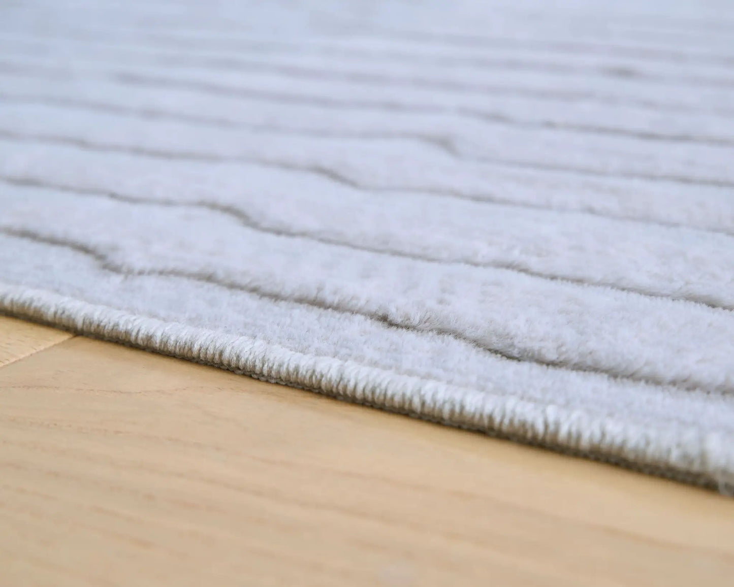 Worthley washable rug, white plush shag on light wood floor on Tampa Home & Garden Store