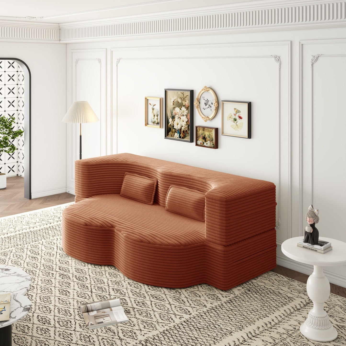 Convertible foam-filled sleeper sofa bed with 2 pillows in rust-orange ribbed fabric on Tampa Home & Garden Store