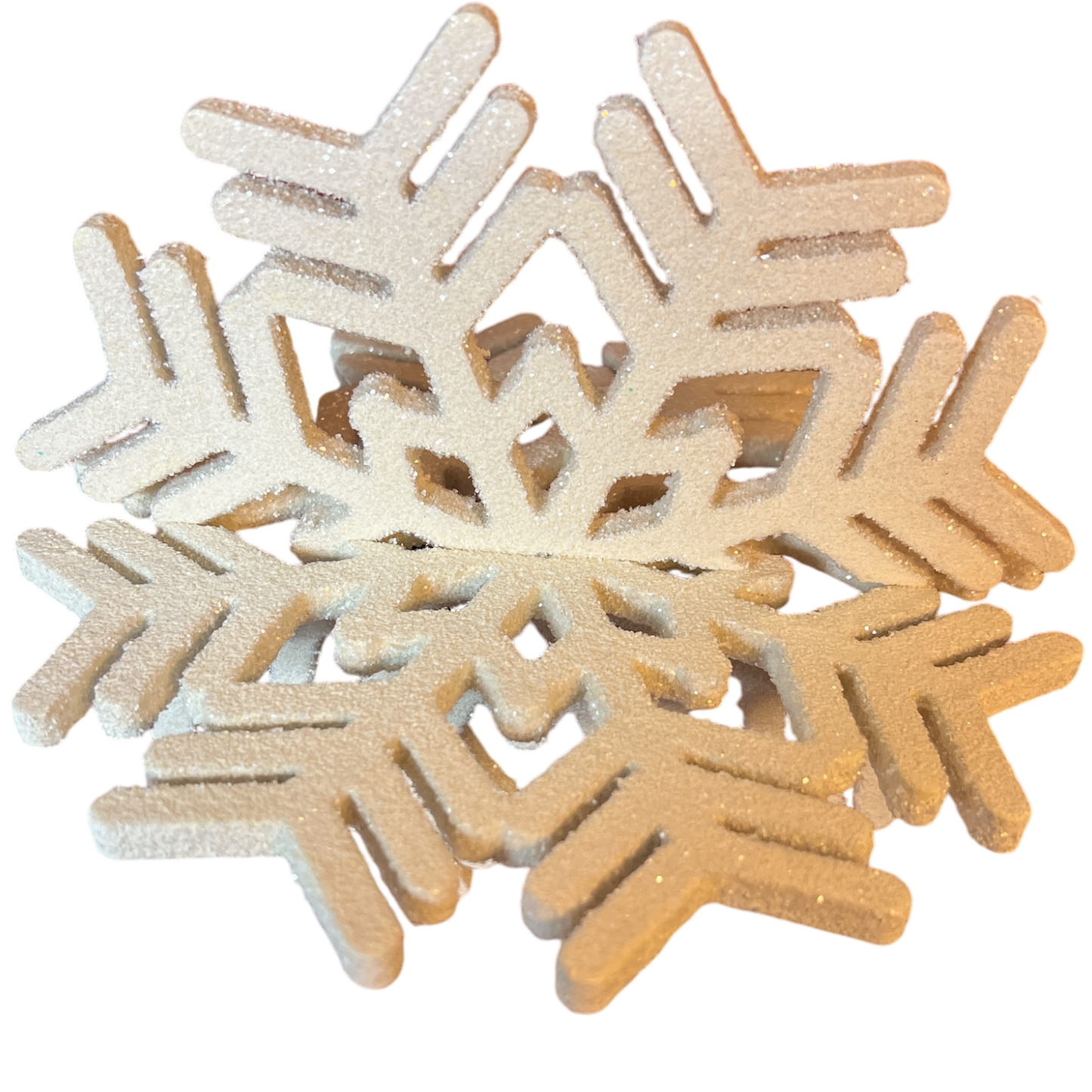 Sparkling white wooden snowflake ornaments in a glittery cluster for Christmas decor on Tampa Home & Garden Store