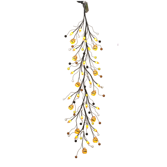 Lighted Halloween garland with jack-o'-lantern pumpkins and twig branches, warm lights on Tampa Home & Garden Store