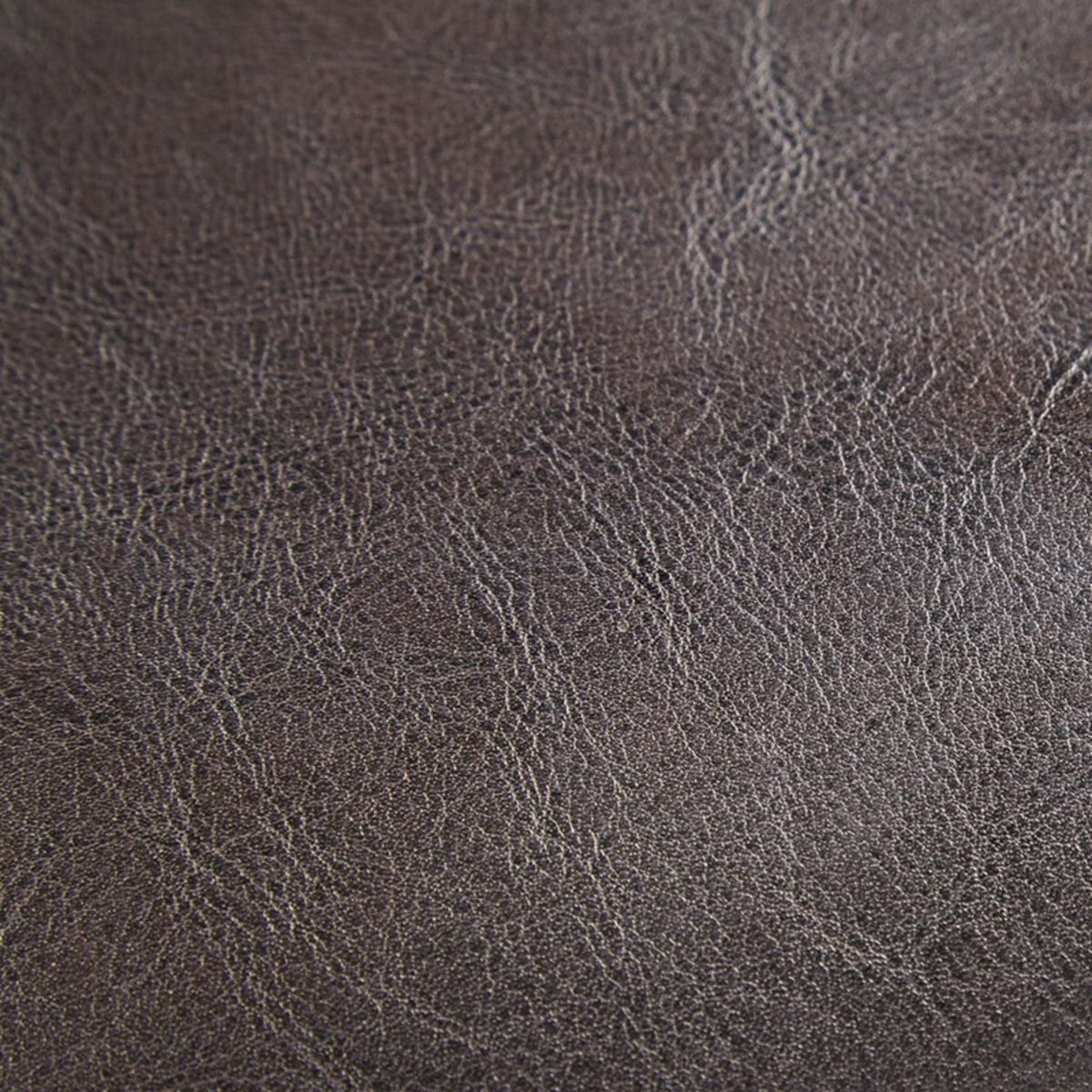 Chocolate faux leather side chair upholstery close-up with rich grain texture on Tampa Home & Garden Store