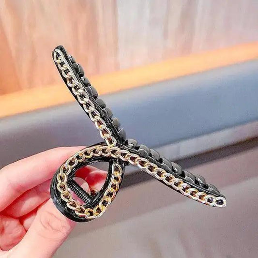 Stevvex black acrylic hair claw clip with gold chain detailing on Tampa Home & Garden Store