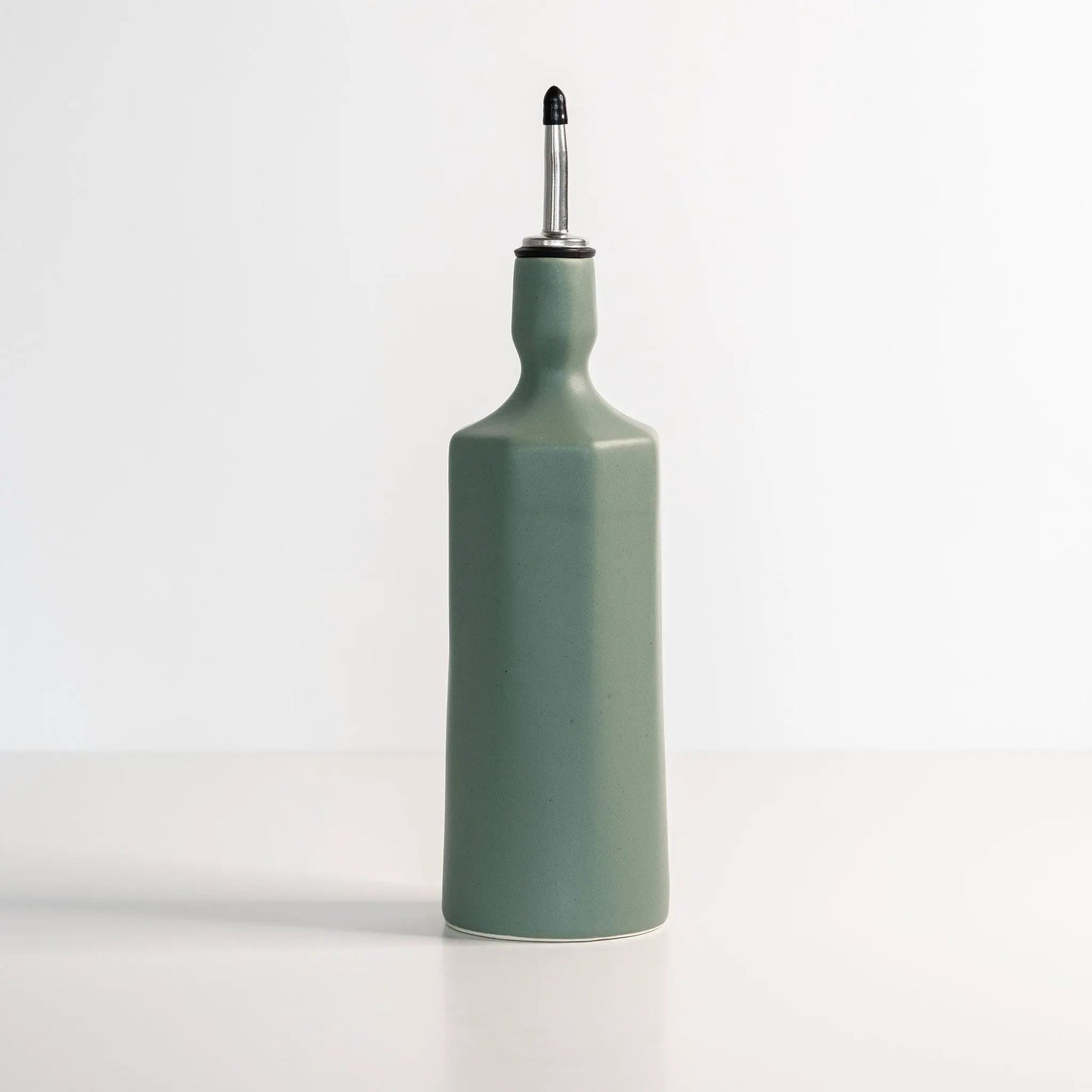 Elixir Porcelain Olive Oil Dispenser with sage-green porcelain body and metal pour spout on Tampa Home & Garden Store