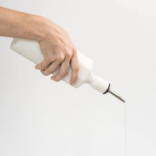 Elixir Porcelain Olive Oil Dispenser by Ember Collective; porcelain bottle with metal pour spout on Tampa Home & Garden Store