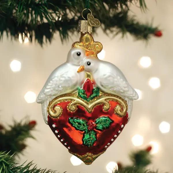Two Turtle Doves Glass Ornament with Red Heart, white doves atop a gold-trimmed heart on Tampa Home & Garden Store