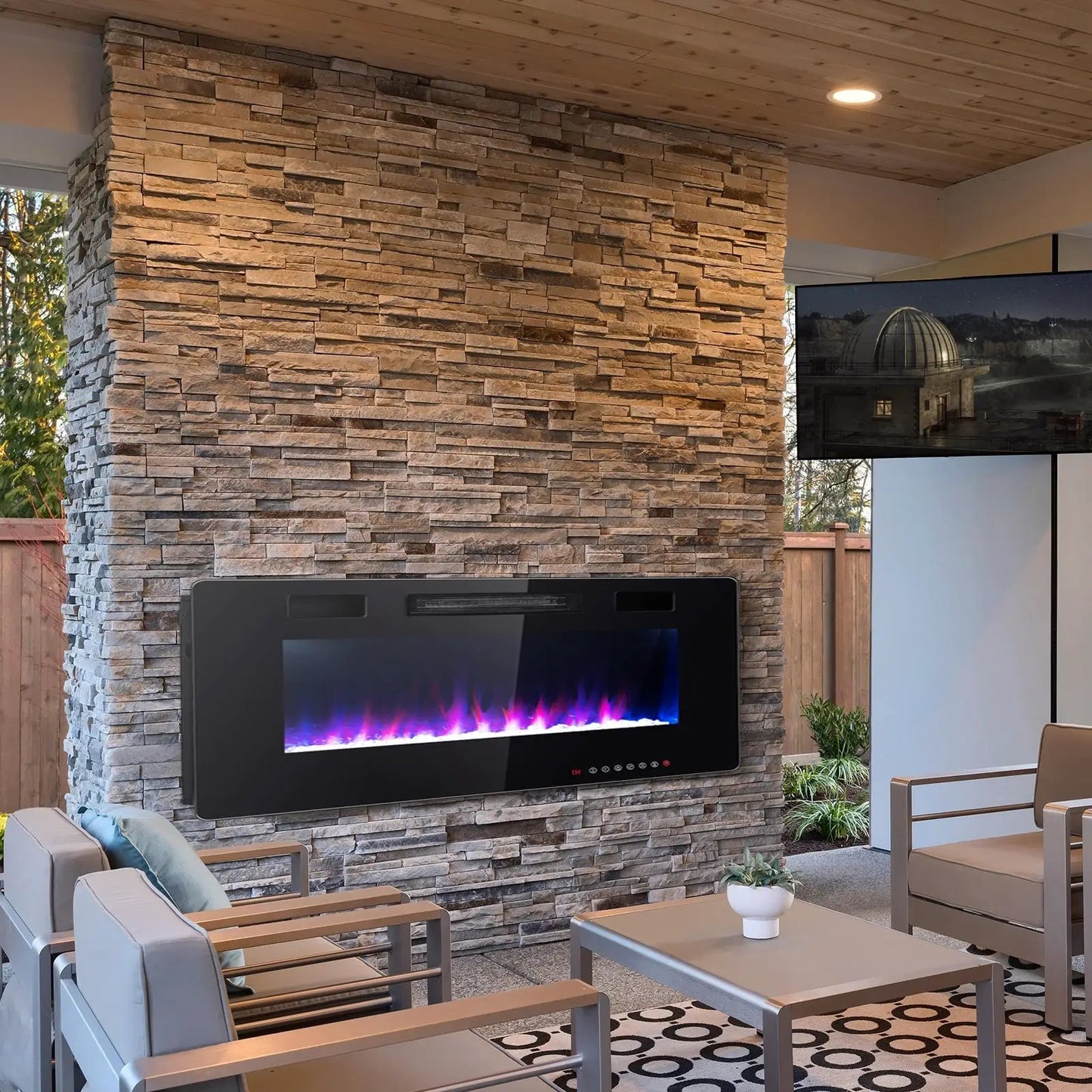 60-inch ultra-thin electric fireplace with two heat settings built into a stacked-stone wall on Tampa Home & Garden Store
