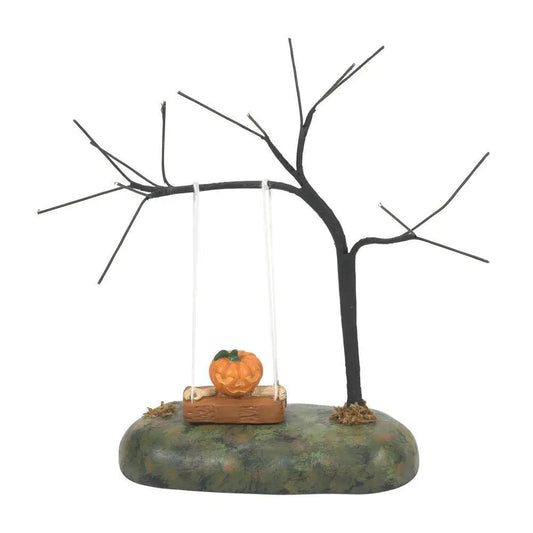 Swinging Scary Gourd Carved Pumpkin Ornament orange pumpkin on a swing under a black tree on Tampa Home & Garden Store