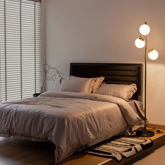 3-globe floor lamp with white glass globes, golden finish, foot switch beside bed on Tampa Home & Garden Store
