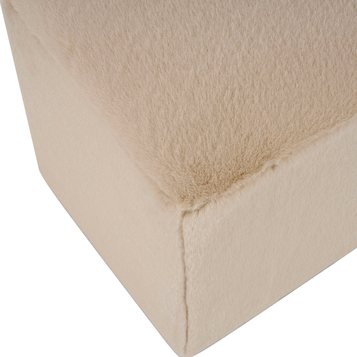 Long plush almond upholstered ottoman close-up of beige fur-like fabric on Tampa Home & Garden Store