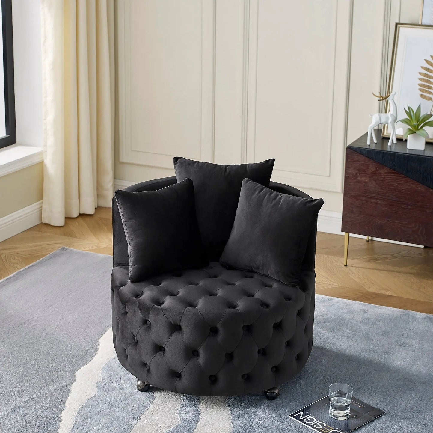 Swivel ottoman black with button tufting and casters in a modern living room on Tampa Home & Garden Store