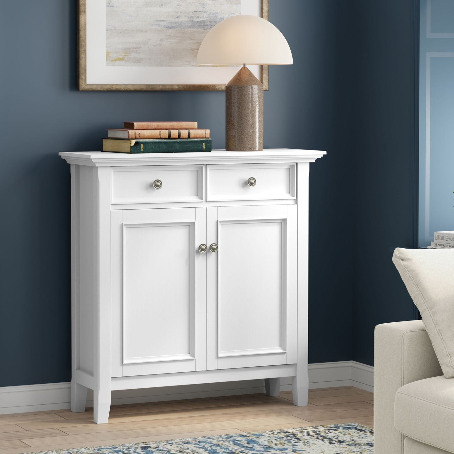 Amherst Storage Cabinet by HouseOfZazla, white finish with lamp and books on Tampa Home & Garden Store