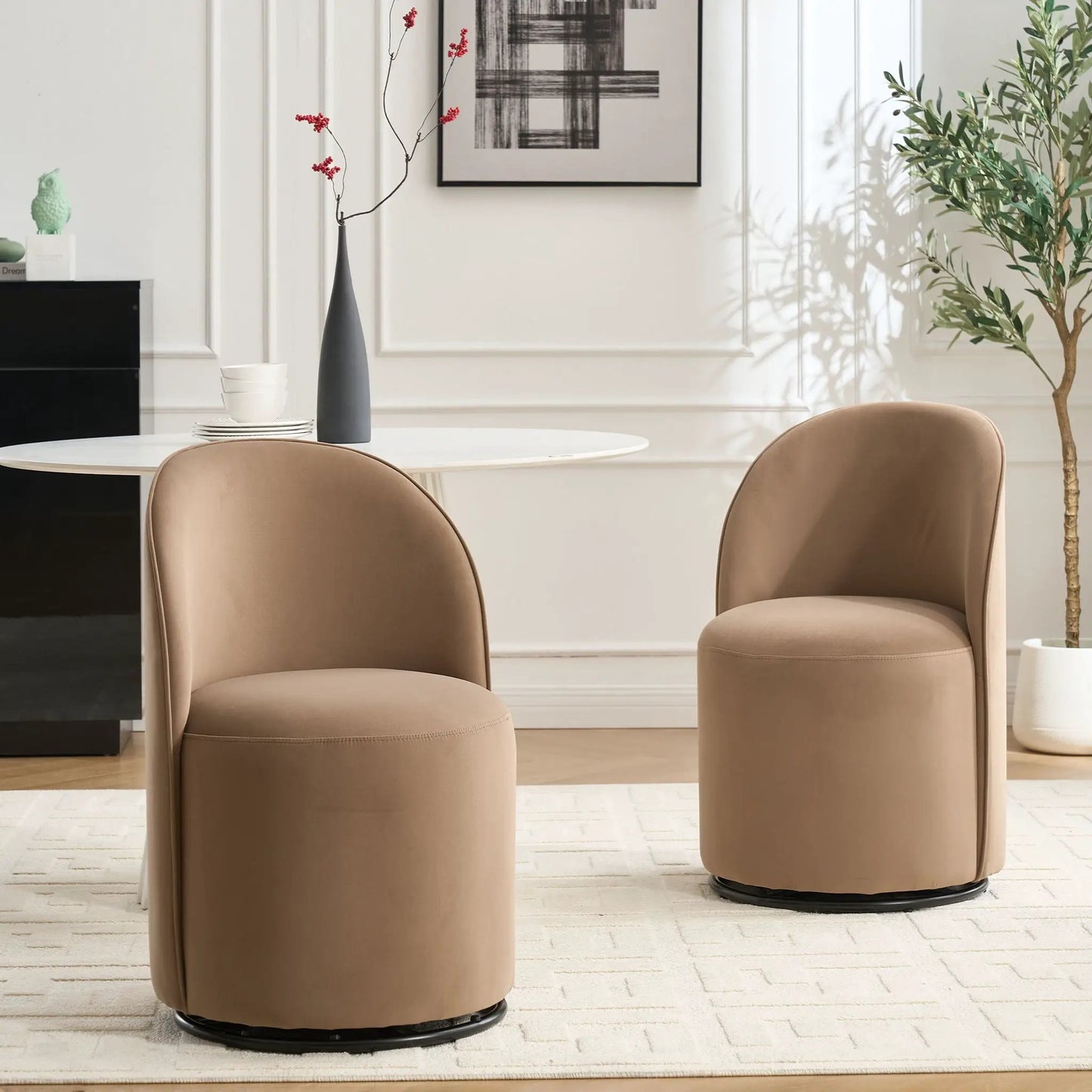 Pair of 360 Degree Swivel Armless Dining Chairs in taupe leather around a white round table on Tampa Home & Garden Store