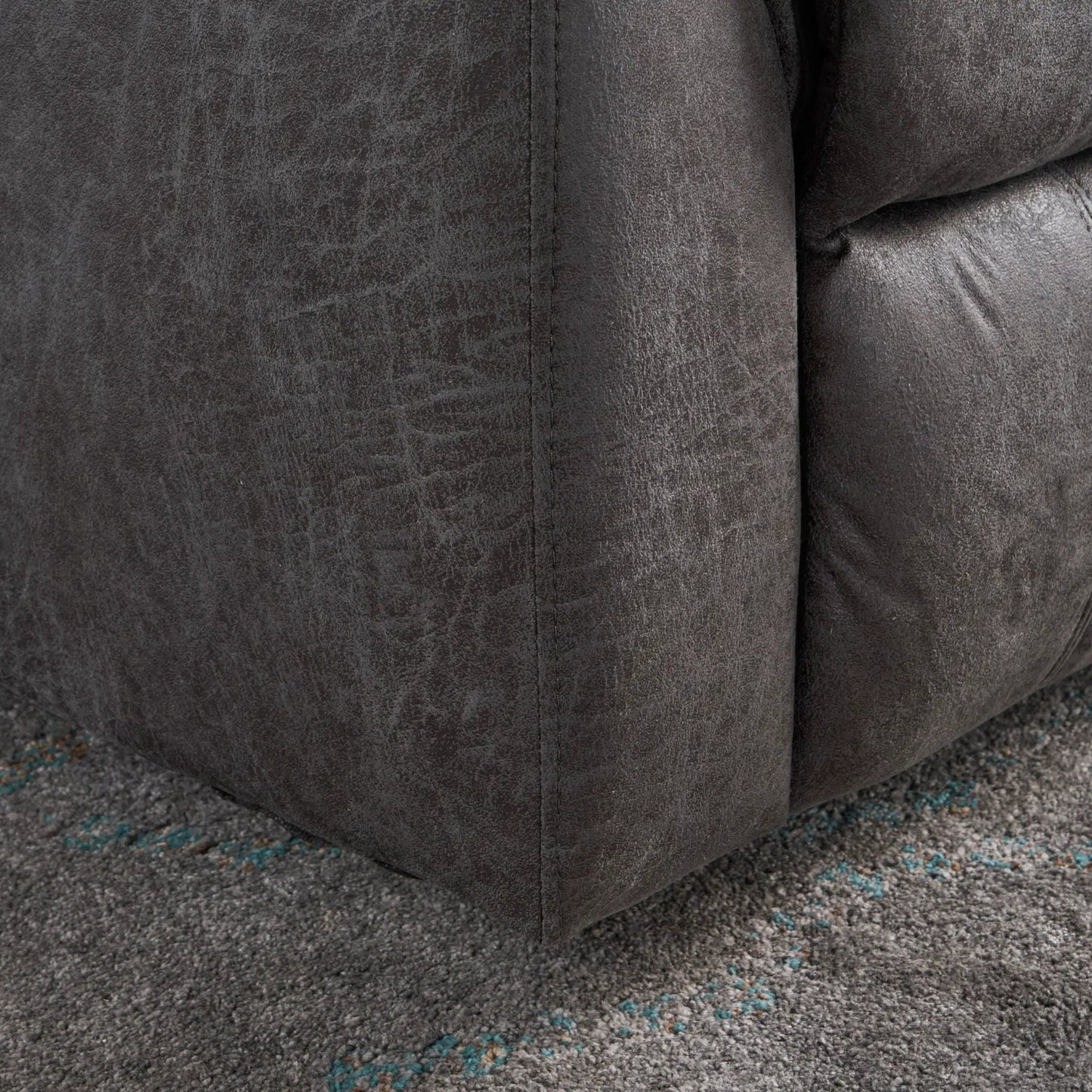 Contemporary glider recliner fabric close-up in dark gray distressed faux leather texture on Tampa Home & Garden Store