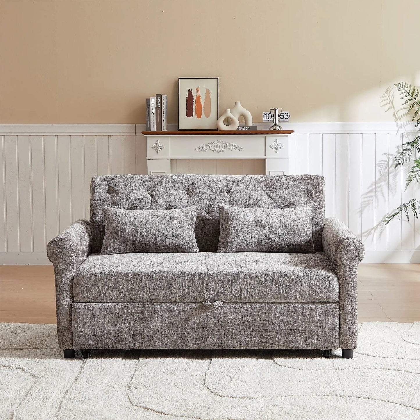 Loveseat sofa bed with pull-out sleeper in gray textured fabric and 2 pillows in a living room on Tampa Home & Garden Store