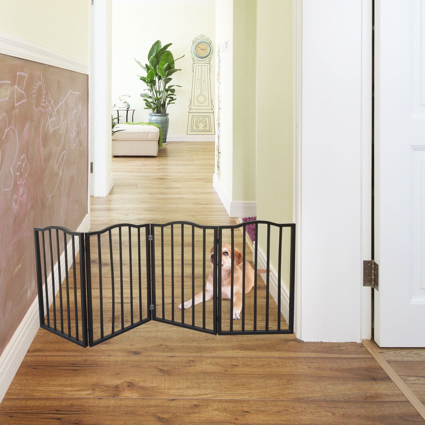 Dog gate dark brown metal barrier across hallway; dog peeks through, chalkboard wall behind on Tampa Home & Garden Store
