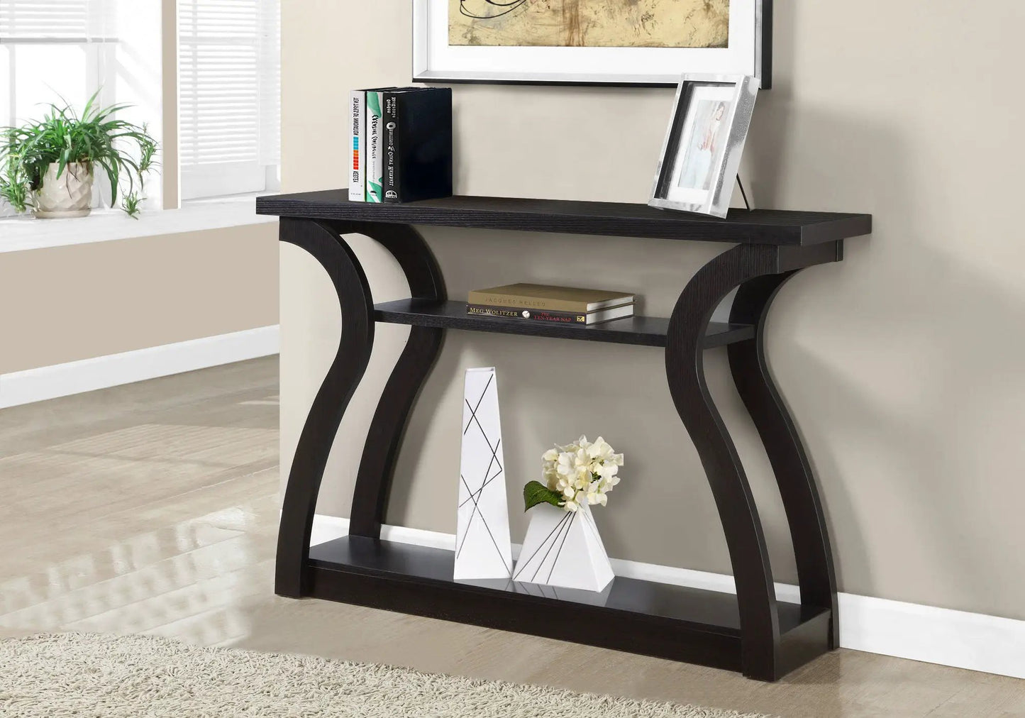Accent Console Table dark wood with curved arch legs, two-tier shelf, top with books on Tampa Home & Garden Store