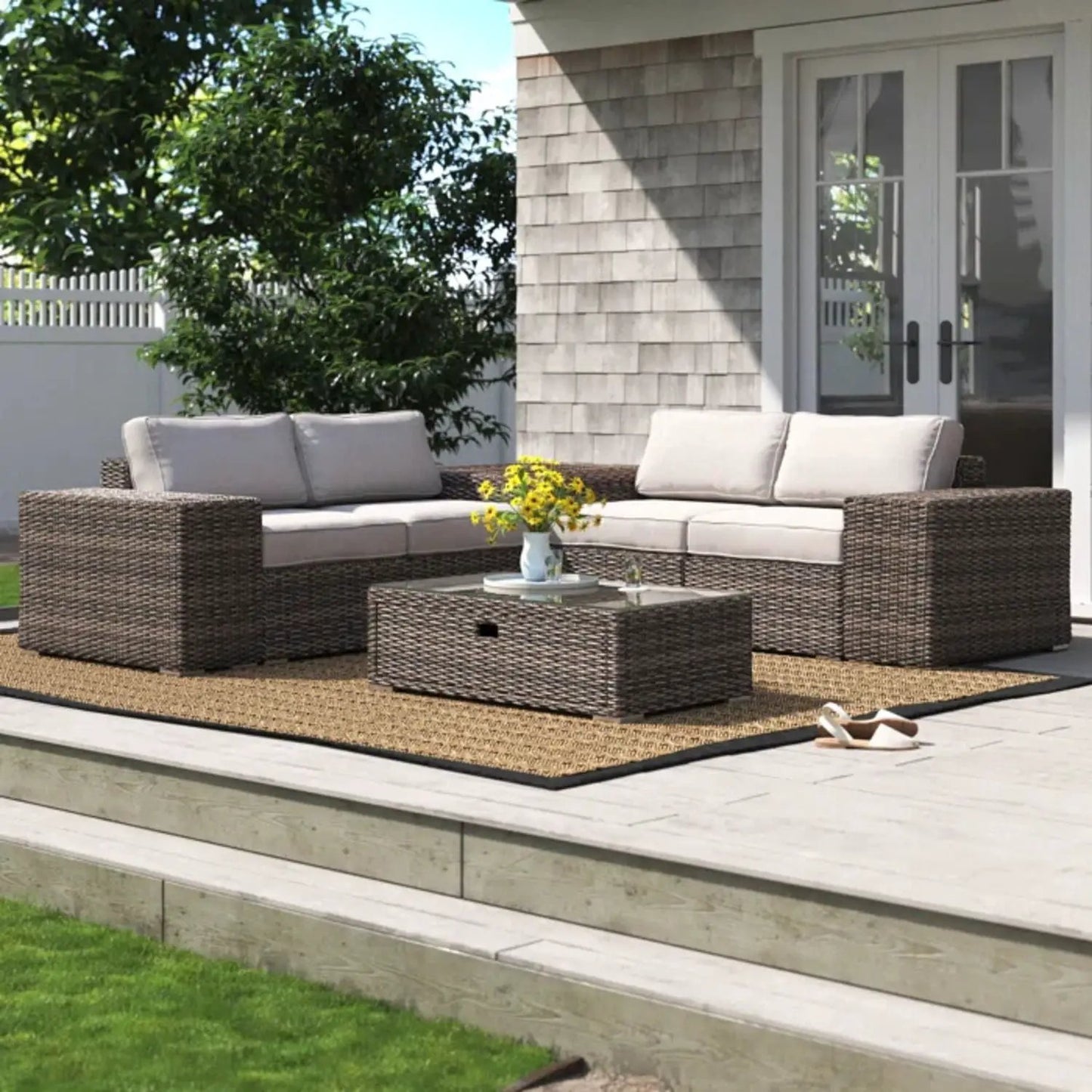 Modern patio rattan sectional set with beige cushions, glass-top coffee table on Tampa Home & Garden Store