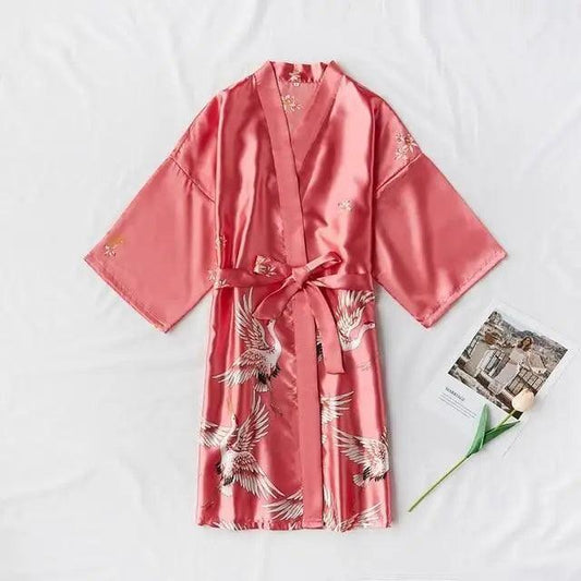 Stevvex pink satin robe with white crane print, kimono style, belt tied on Tampa Home & Garden Store