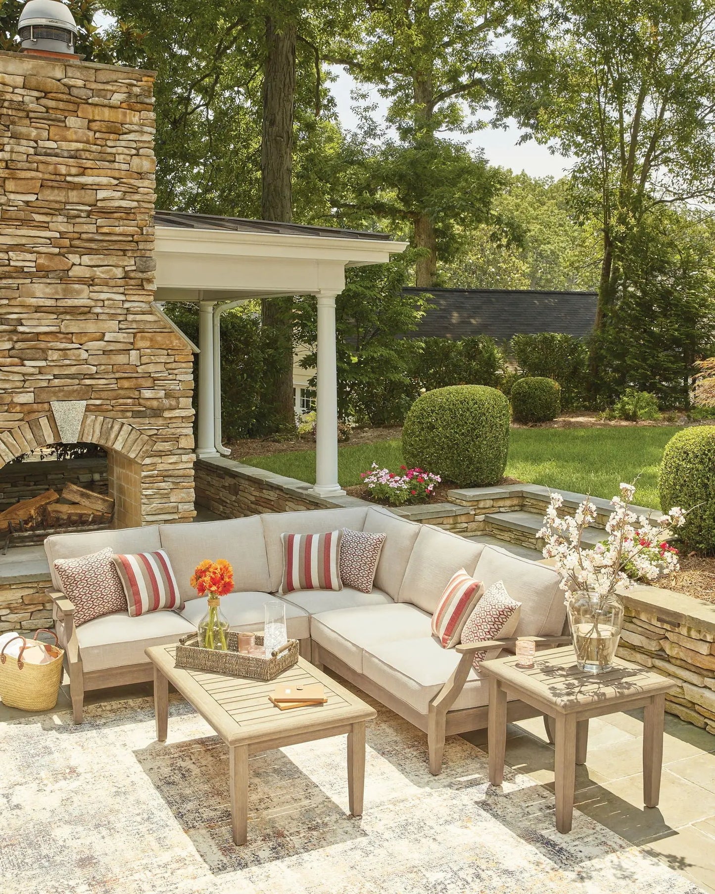 Clare View Outdoor Sectional with beige cushions on a wood frame on Tampa Home & Garden Store