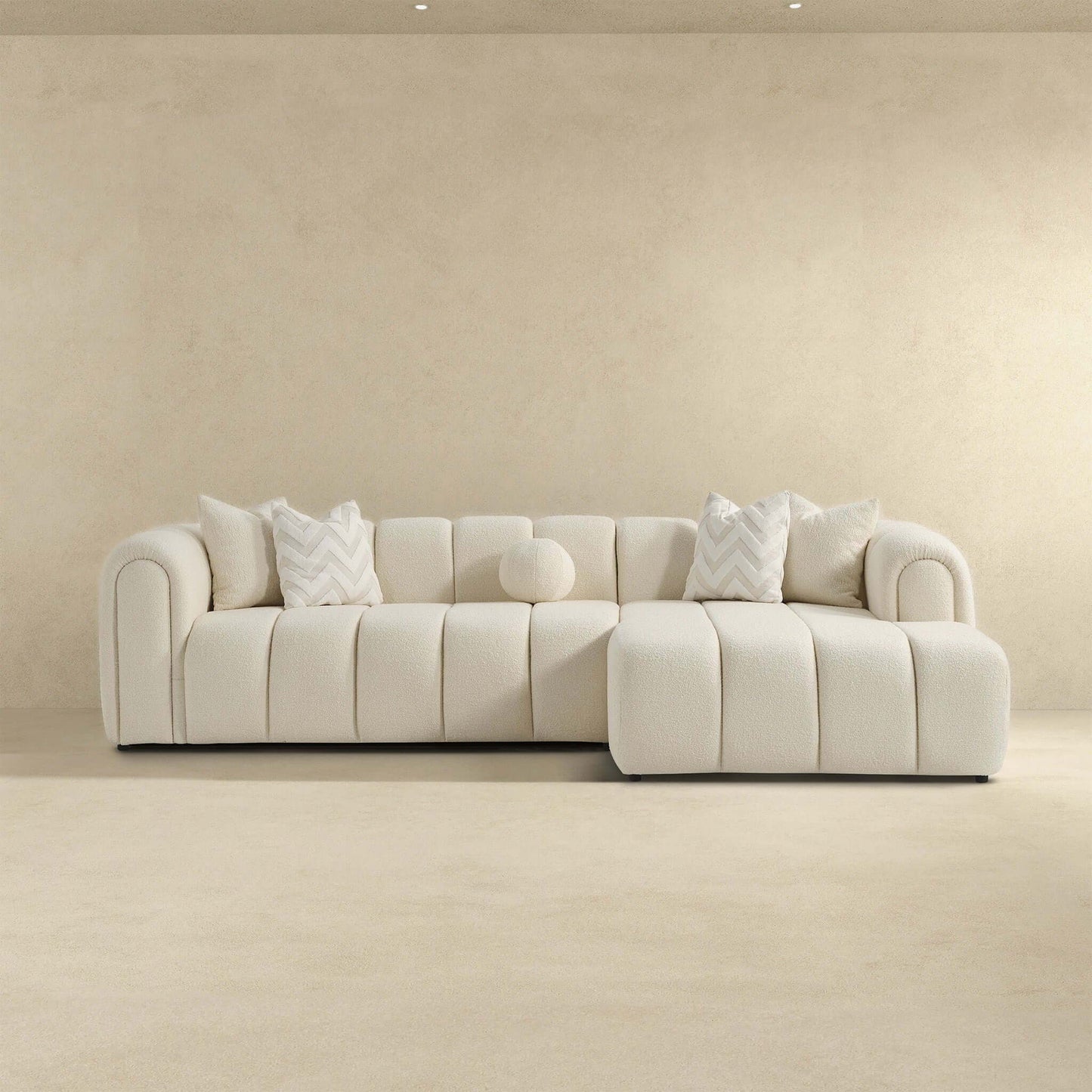 Beatrice ivory modern tufted right sectional sofa by HouseOfZazla with chevron pillows on Tampa Home & Garden Store