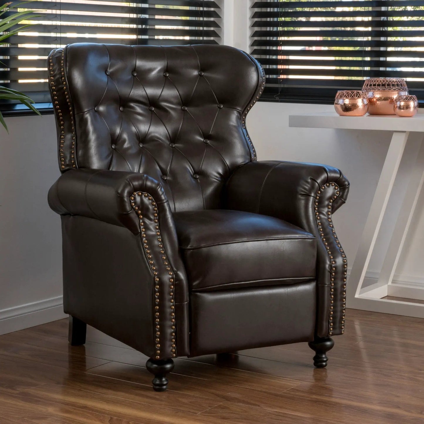 Contemporary push-back recliner in dark brown leather with tufted back and nailhead trim on Tampa Home & Garden Store