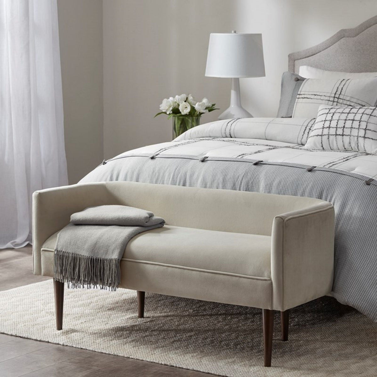 Cream upholstered accent bench by HouseOfZazla with low back and solid wood legs on Tampa Home & Garden Store