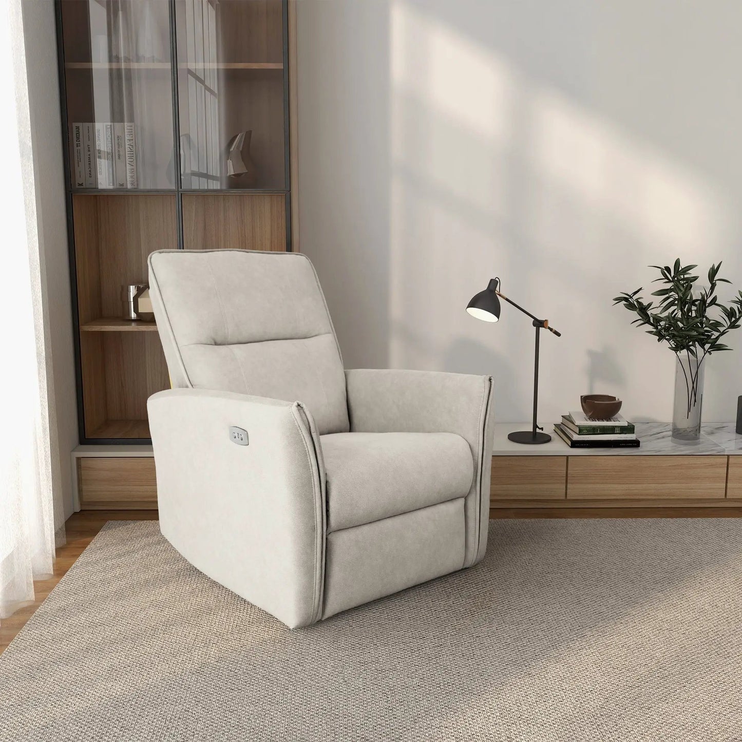 Asheville suede recliner chair in light gray upholstery beside a cabinet and black floor lamp on Tampa Home & Garden Store