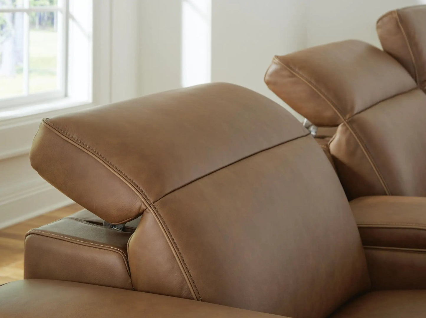 Magic Man reclining sectional by Unique Piece Furniture in tan leather cushions on Tampa Home & Garden Store