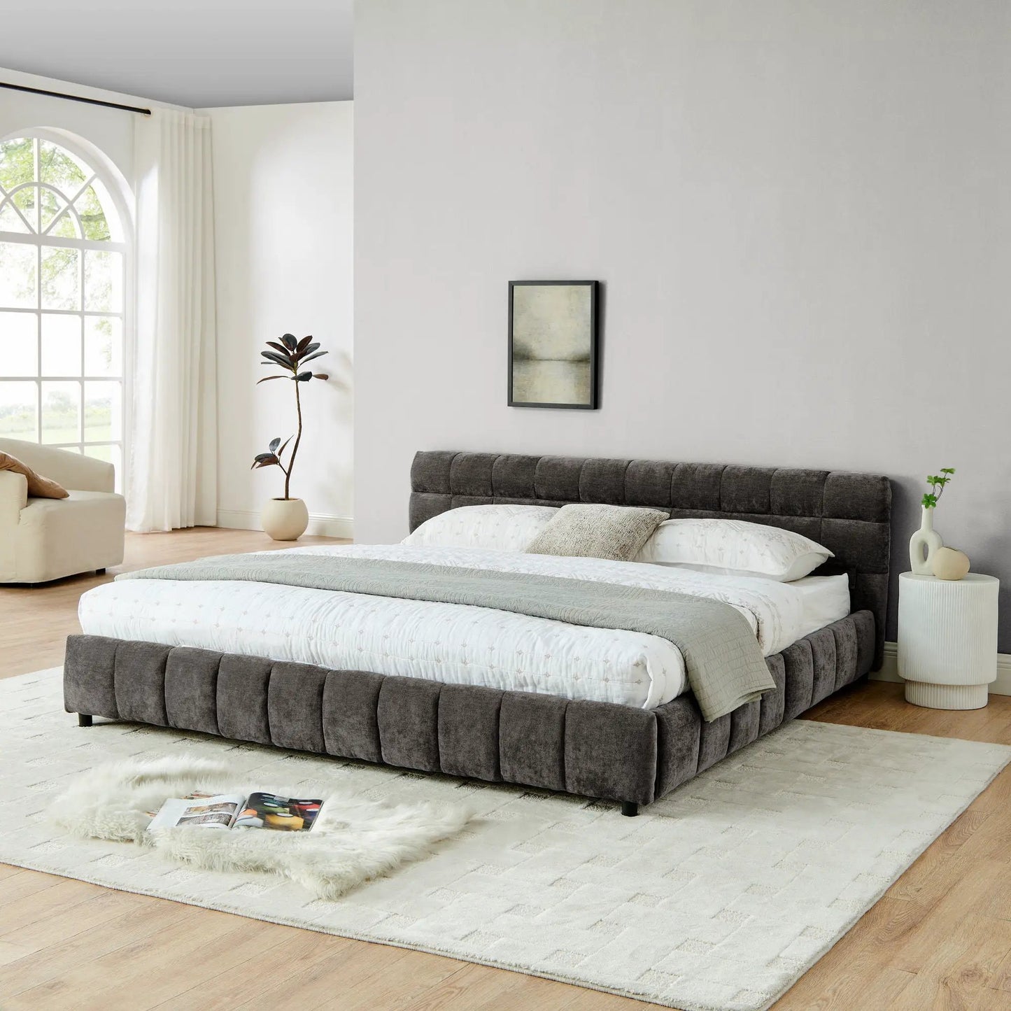 Pair of gray fabric upholstered storage platform beds with tufted headboards in a bright bedroom on Tampa Home & Garden Store