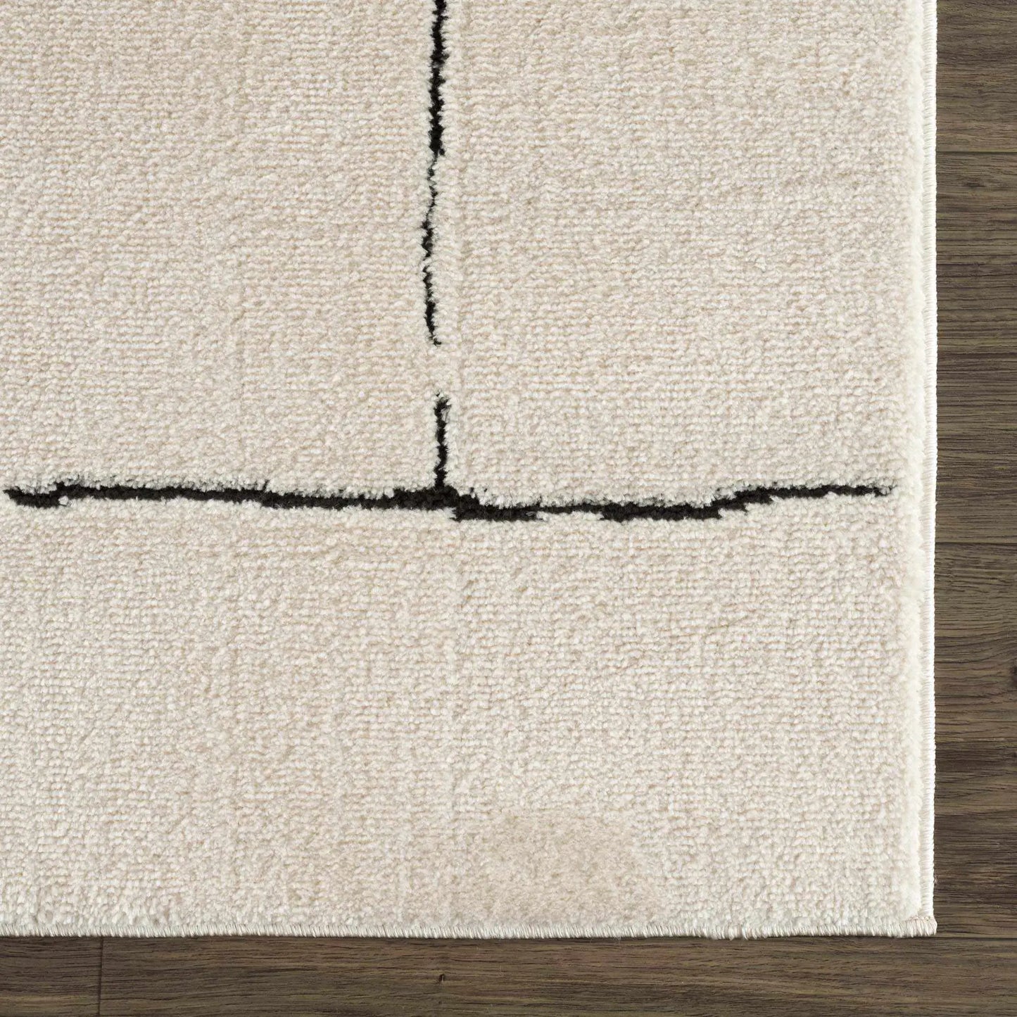Koume Beige Maze Area Rug machine-woven polyester with black maze stripe on wood floor on Tampa Home & Garden Store