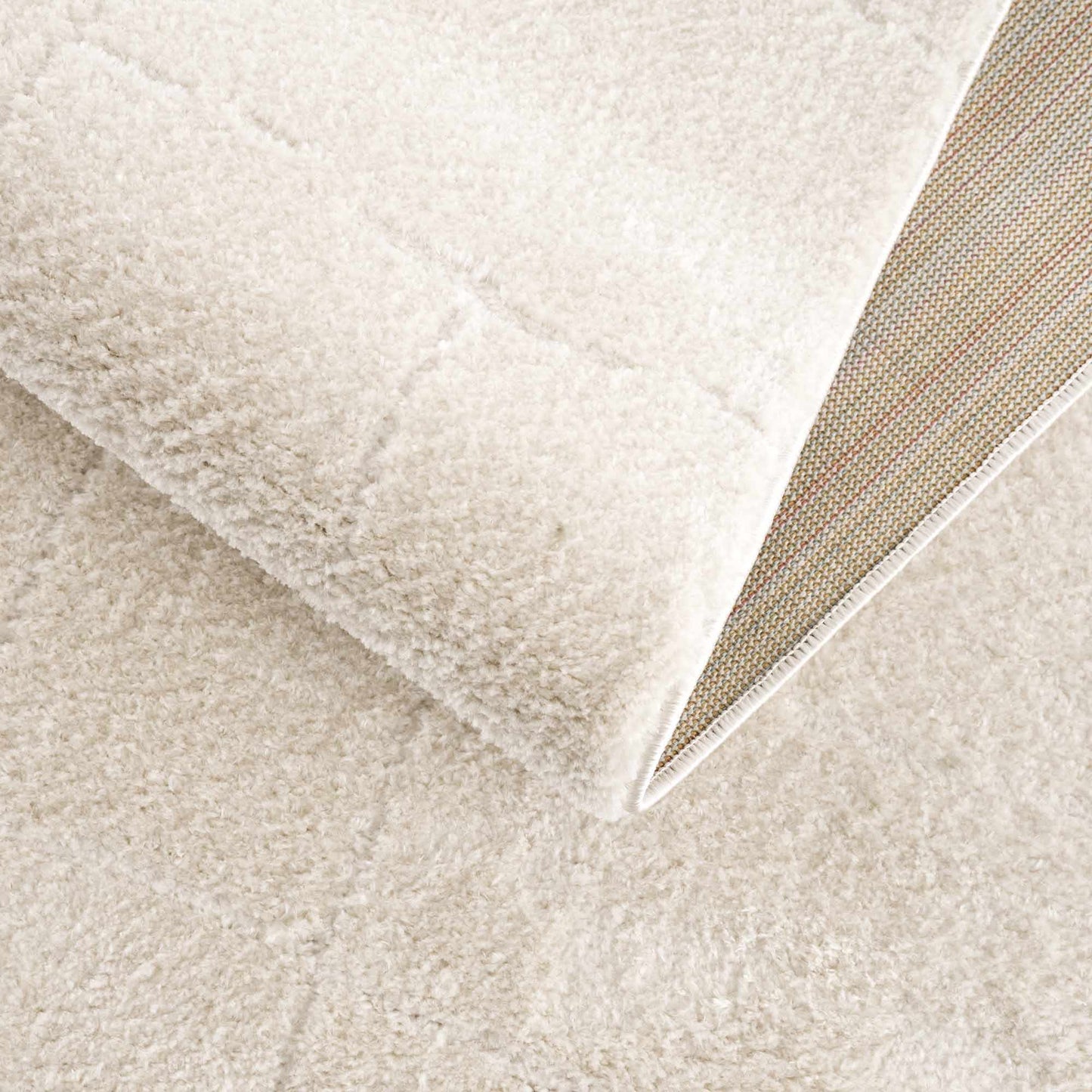 Koume Ivory Area Rug by Boutique Rugs, plush ivory shag with bound edge on Tampa Home & Garden Store