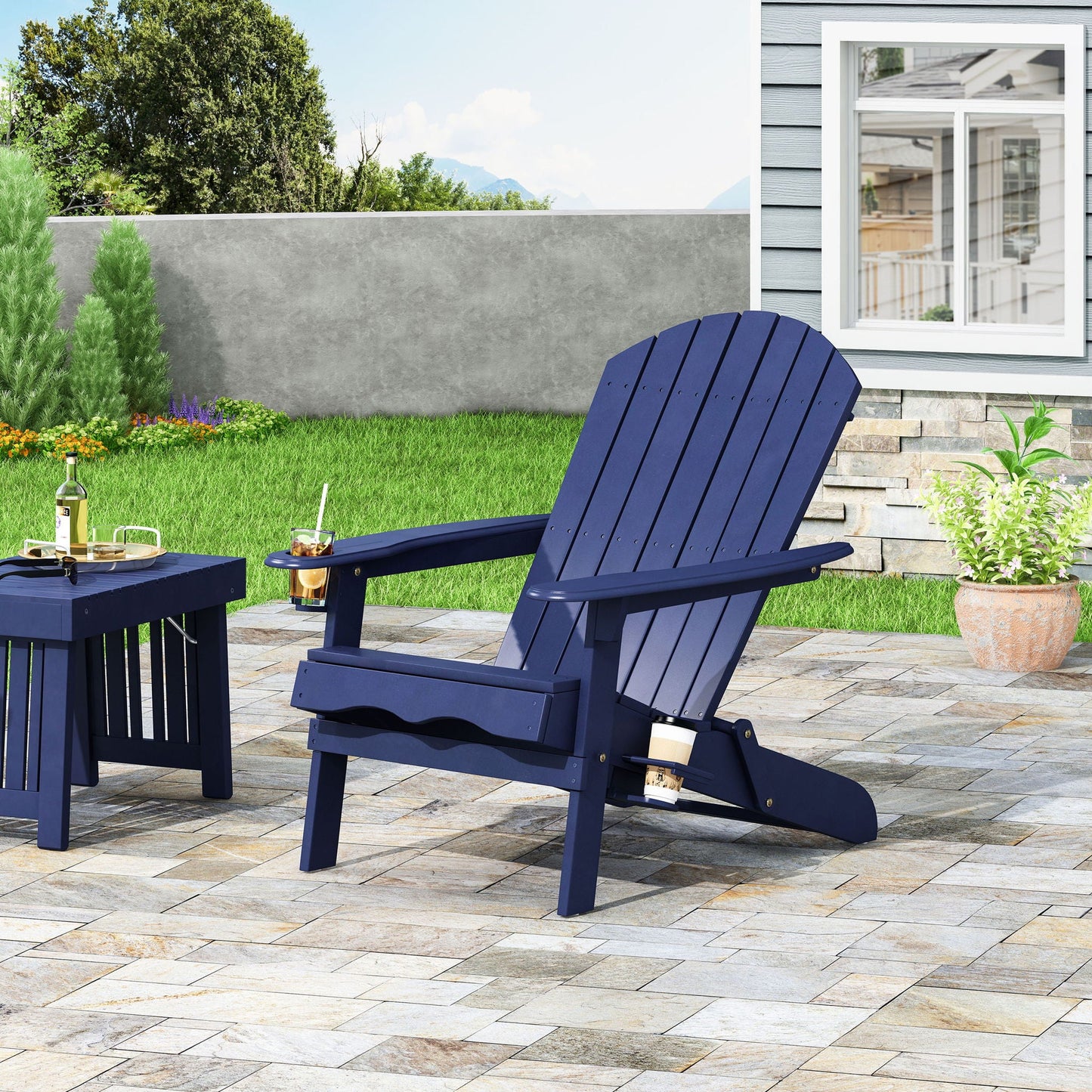 Zenithia outdoor foldable Adirondack chairs in navy blue with 2 cup holders on a patio on Tampa Home & Garden Store