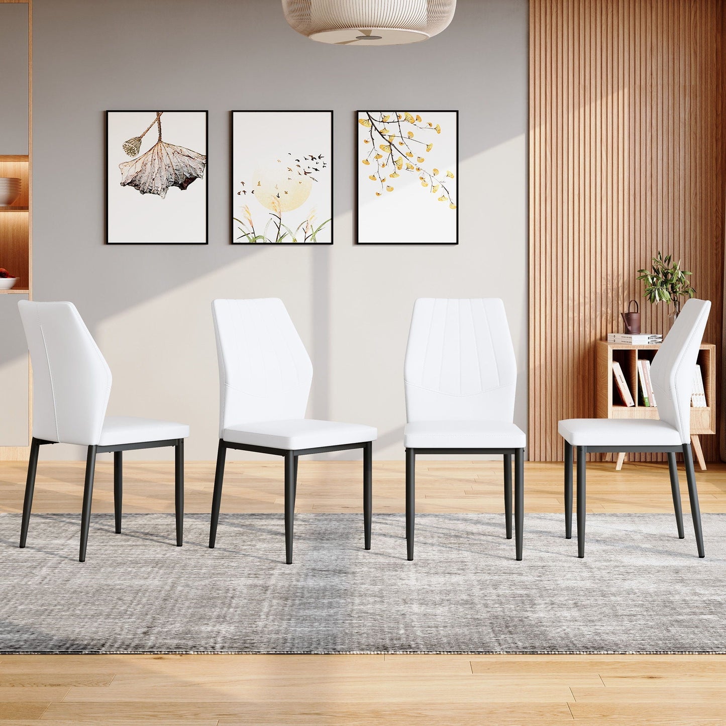4 white dining chairs with black legs in a modern dining room on Tampa Home & Garden Store