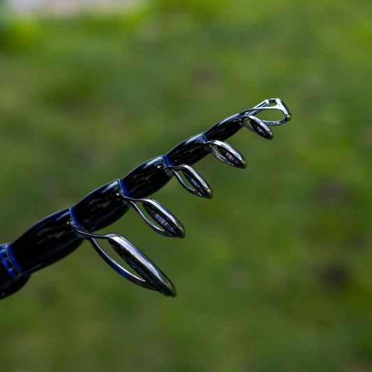 Reaction Tackle Telescopic Spinning Rod carbon tip guides closeup on Tampa Home & Garden Store