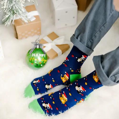 4 Inch Ornament with Holiday Socks navy socks with festive print and green toes beside green ornament on Tampa Home & Garden Store
